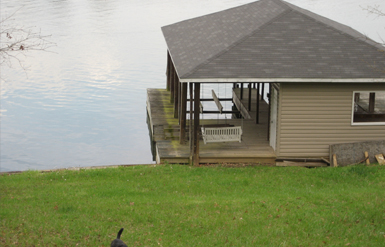 Hyco Lake House | Backyard with Boat House